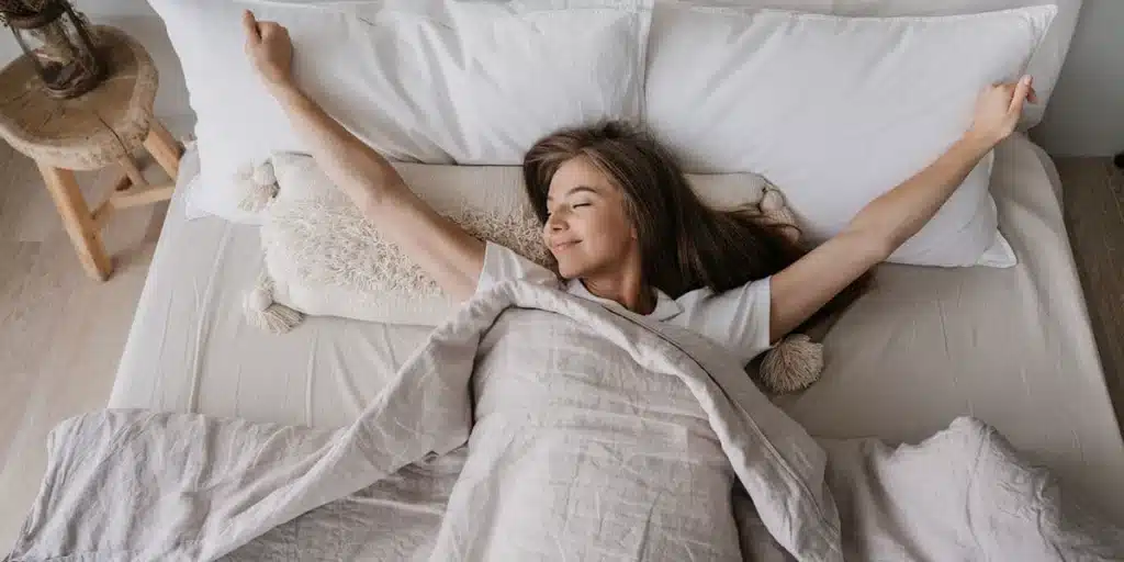woman waking up rested