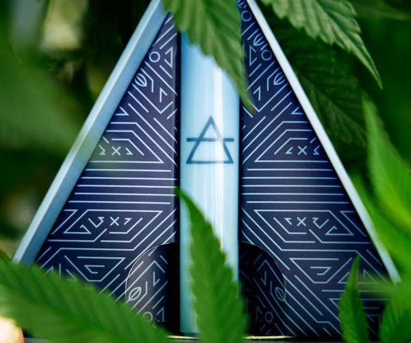 Aero Vape in a triangle box surrounded by cannabis leaves