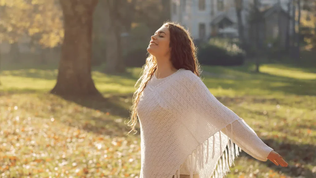woman inhaling fresh air