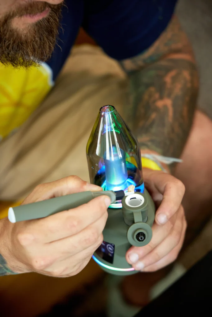 Live rosin being placed into a puffco