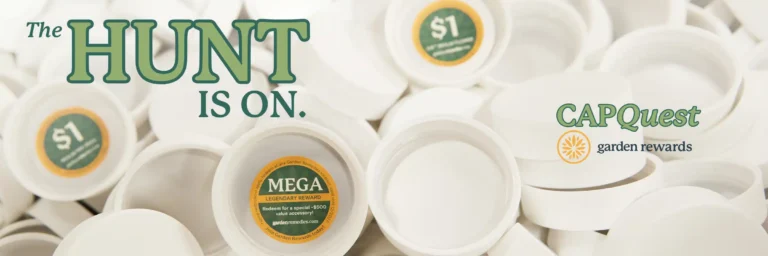 pile of white dram caps, some with stickers. Cap Quest: The Hunt is On