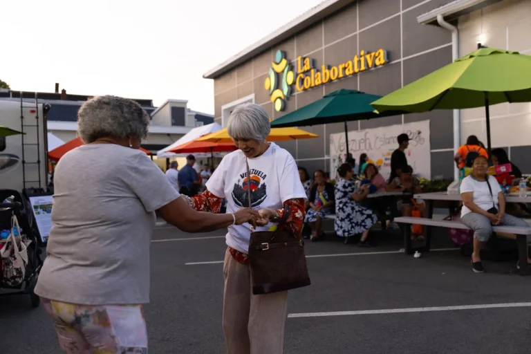 Community Members meet in the parking lot of La Colaborativa for a celebratory event